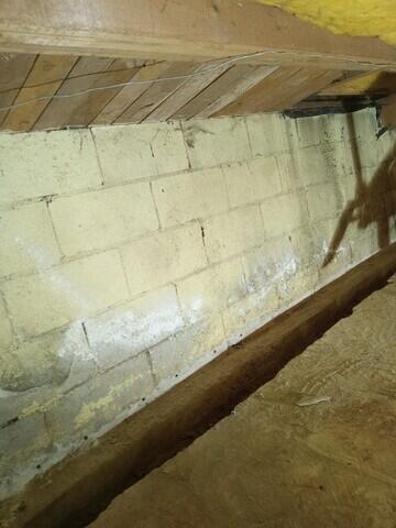 Trench is opened up and weep holes are drilled.