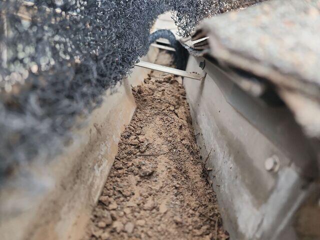 Dirt built up in the gutters