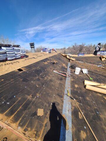 Putting down the Velora One Synthetic underlayment.