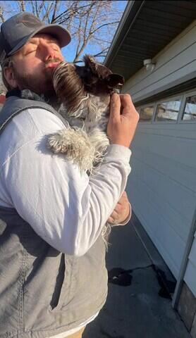 Loving on the home owners dog!