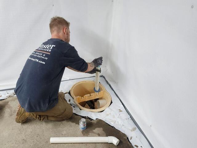 Our crew installing a sump pump.
