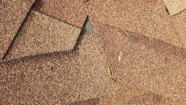 Piece of the shingle missing.