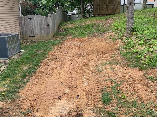 A view from the backyard after our crew finished backfilling the trench.