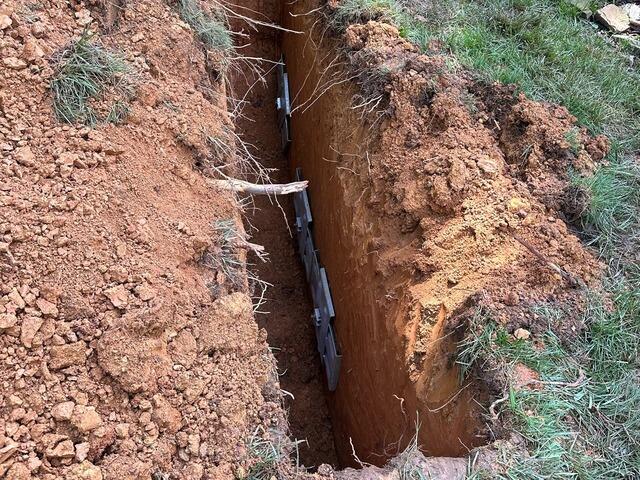 A close-up of the trench showing three Geo Locks.