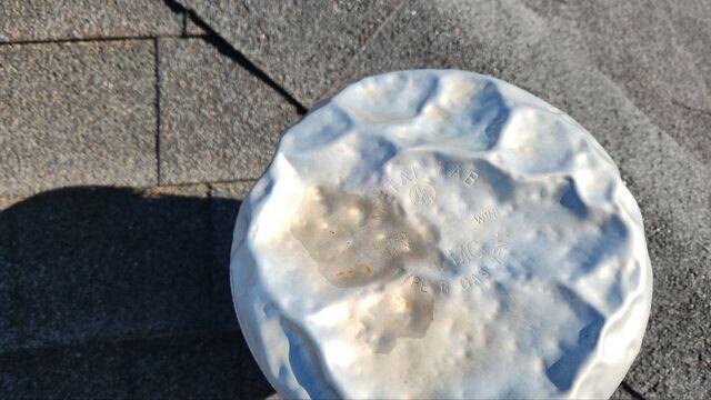 Hail damage to the vent.
