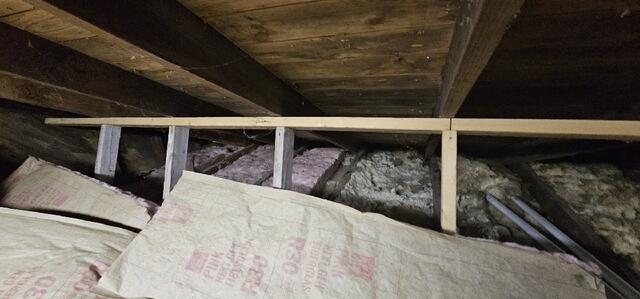 Before: Old Fiberglass Insulation