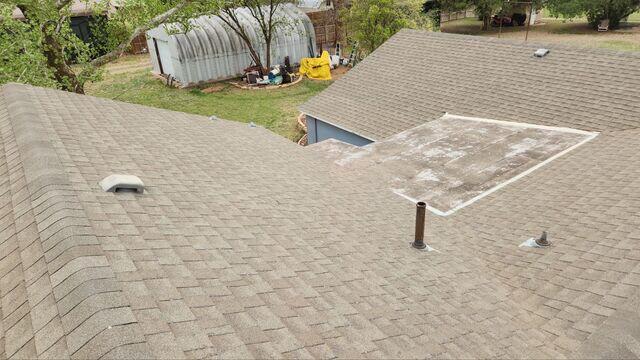 Roof with hail damage and weather damage.
