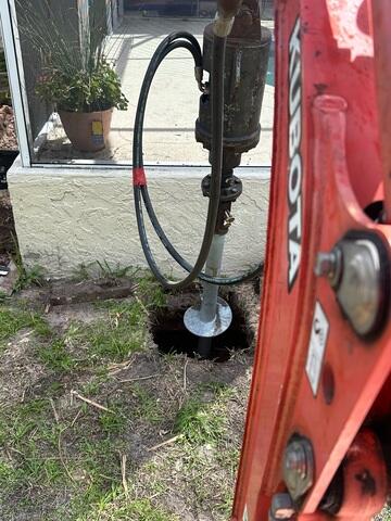 Helical Piers Drilled into Ground
