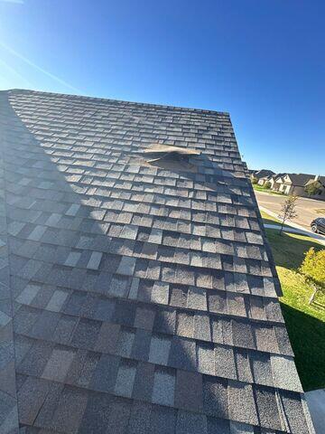 Shingles being flown off.