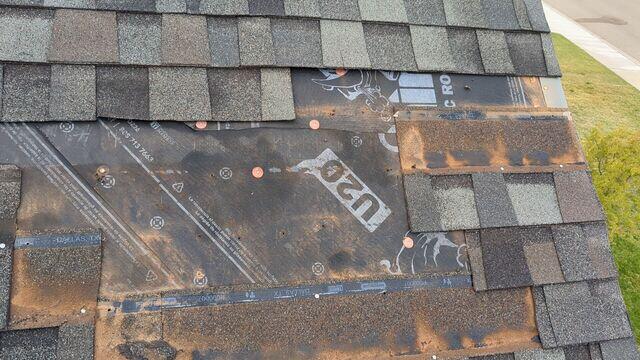 Shingles missing from the roof.
