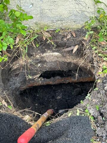 Excavating Soil for Helical Pier Installation