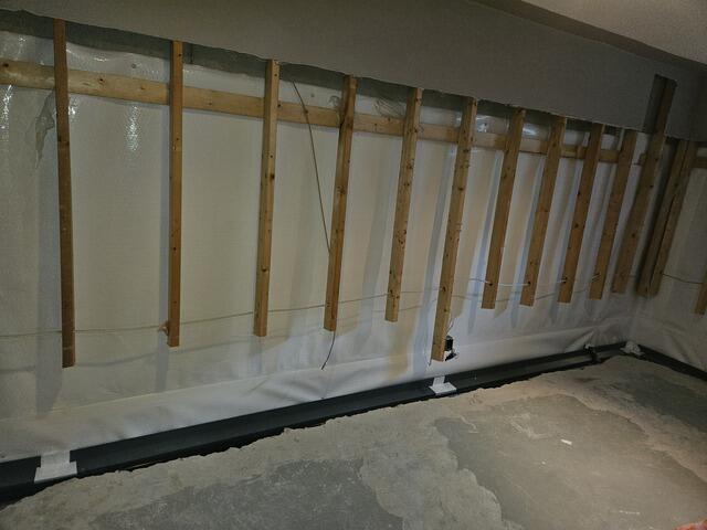 Completed basement waterproofing system