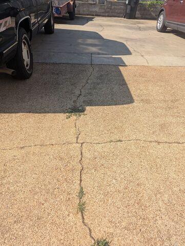 Continues Inspection at Driveway