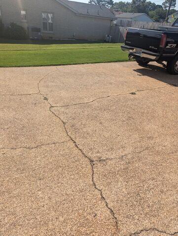 Driveway Infiltrated with Cracks