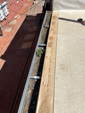 Packed gutter with dirt and debris