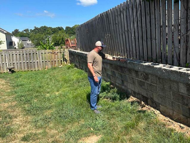 The homeowner indicated the retaining wall needed assistance.