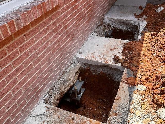 This side shows two Helical Piers properly installed.