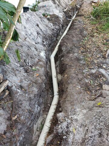 Hard Pipe Diverts Water Away from Foundation