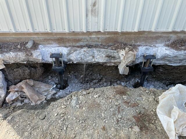 A close-up of the Helical Piers installed.