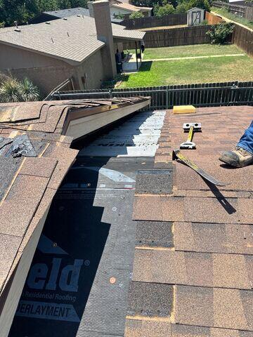 Removal of the shingles in between the home and add on.