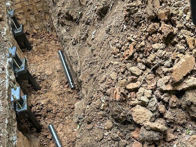 A close-up of four Helical Piers.