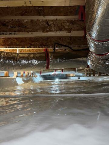 A clean, dry crawl space sealed with CleanSpace liner