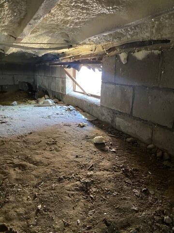 Unsecured Window Entry and Cinderblock Foundation