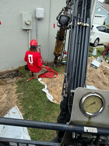 Stabilizing Foundation with Helical Pier System