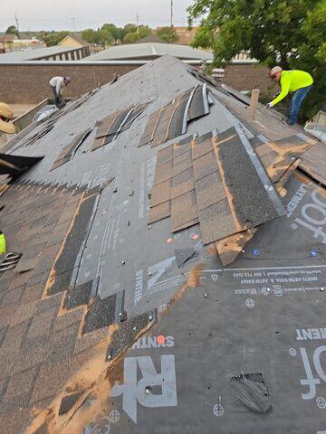 Removing the old shingles.