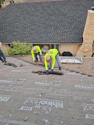 Crew members Removing the shingles.