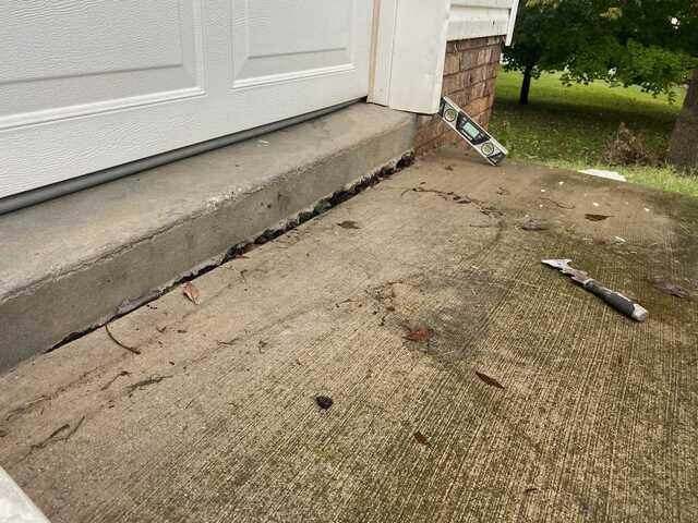 A close-up of the driveway, which had sunk a few inches.