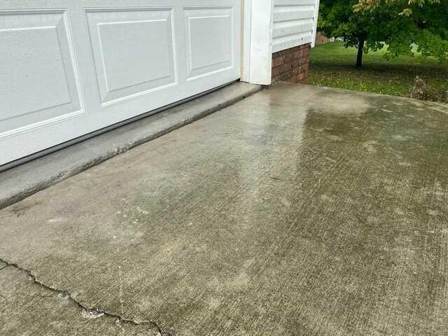 A side view of the driveway after the concrete slab was raised.