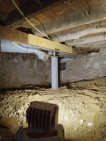 Under a beam or joist