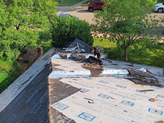 Removing the shinlges from the roof top.