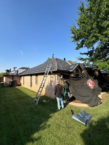 Crew members adding the catch all back up.