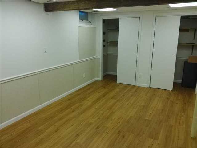 Finished Basement with Walls and Flooring