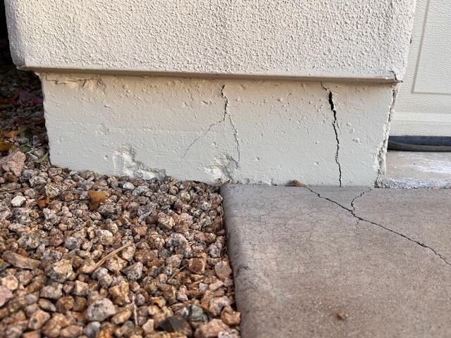 Symptoms of corrosion problems in a concrete stem wall often include vertical cracks, especially here in Phoenix, Arizona