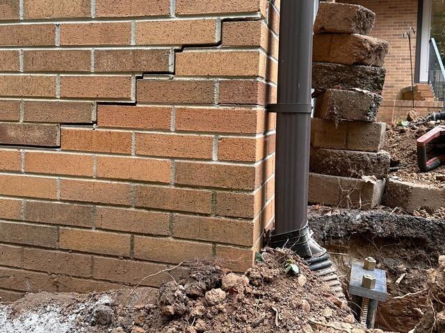A close-up of this wall showing a typical step-stair crack.