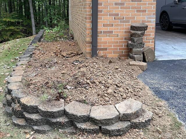 Our crew backfilled the holes after installing the Helical piers.