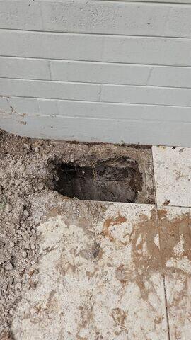 Excavating Soil for Helical Pier Installation