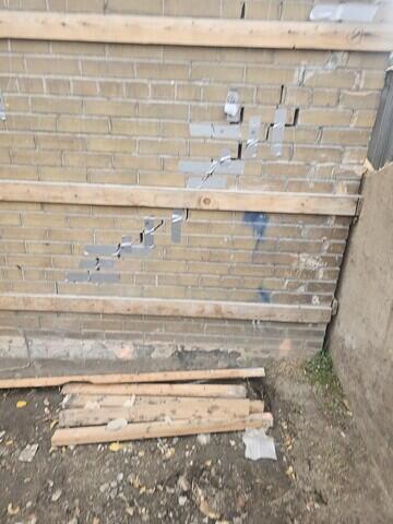 Step cracking in brick facade