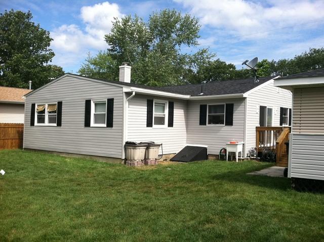 Roofing is Owens Corning Duration Shingle in color: Onyx

Siding was done in a 5 inch Dutch Lap in Sterling Gray with black shutters,

Gutters are: 5" White Aluminum Seamless gutters with 2x3 Leaders
