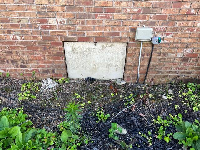 Worn-Out Crawl Space Door
