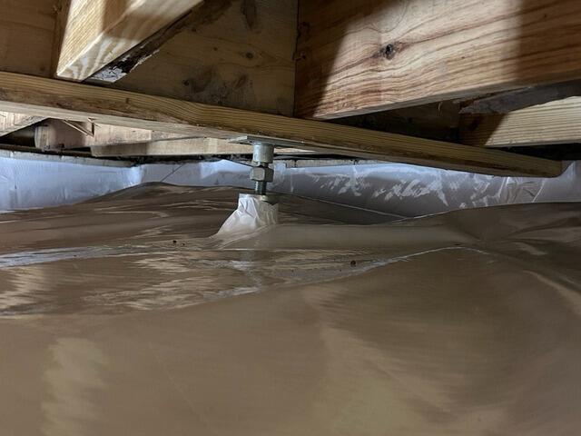 A close-up of a SmartJack installed prior to encapsulating the crawlspace.