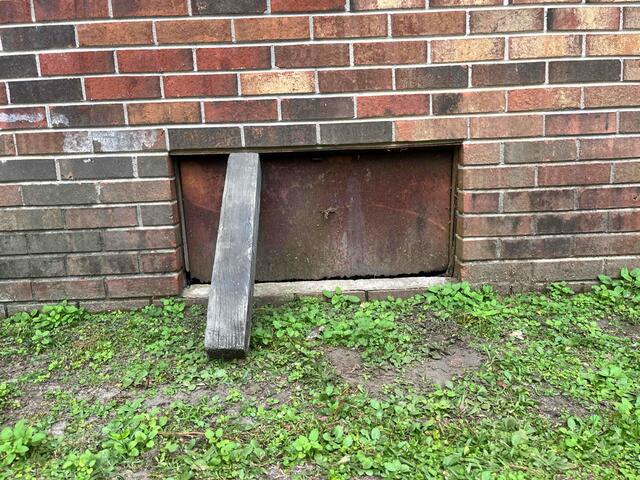 Rusted Crawl Space Door