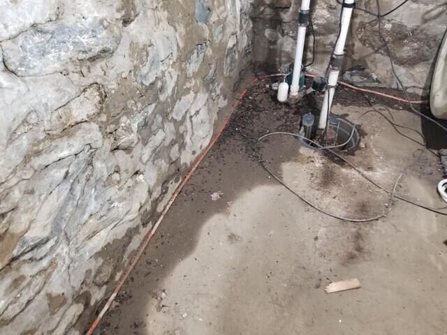 Old Sump Pump and Wet Basement