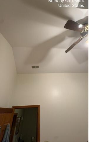 Bedroom wall and ceiling above door