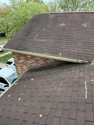 Existing Roof with Damaged Gutters