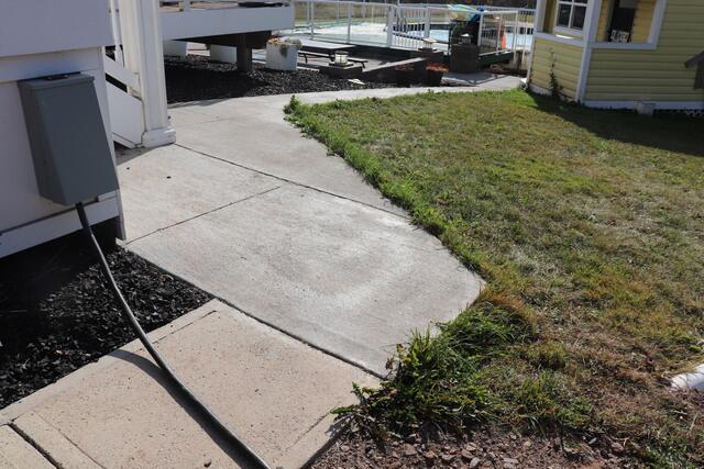 Worn-Out Concrete Sidewalk Before Transformation