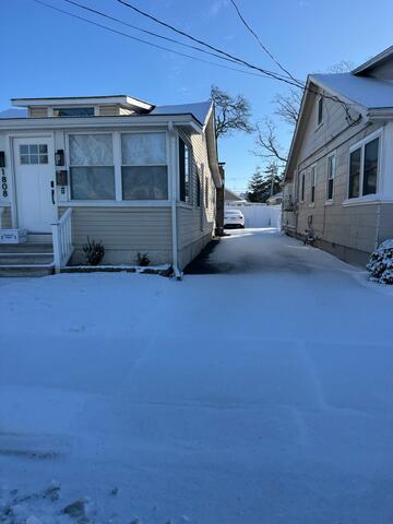Before the Cleanup: A Snow-Covered Entrance